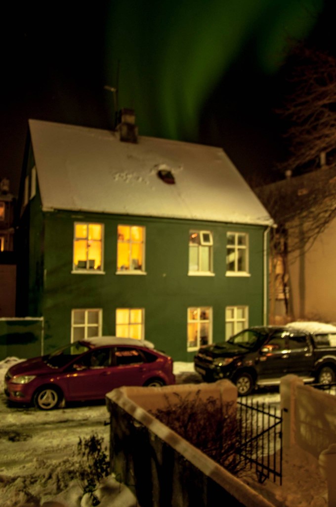 Northern lights dancing over Reykjavik in december